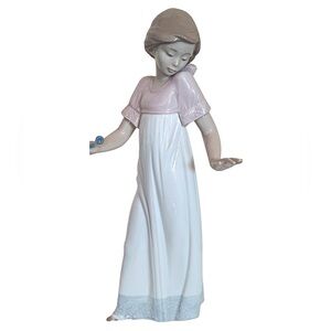 Vintage Lladró Nao porcelain figurine titled "To Light the Way,"